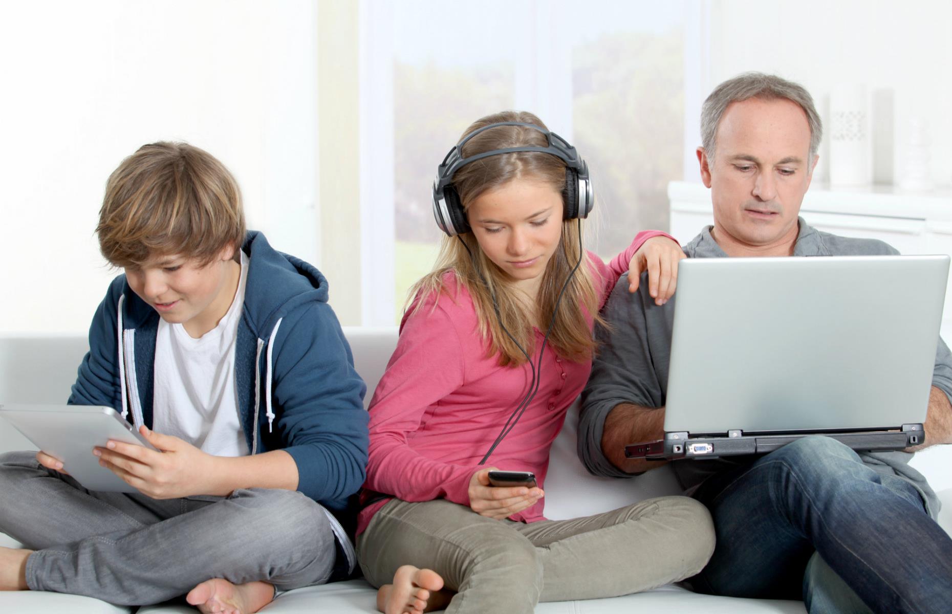 Dad and kids on devices